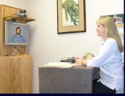 MO telehealth Karen Edison, director of the Center for Health Policy, talks with a patient via videoconferencing technology from the Missouri Telehealth Network. The technology is part of a grant-funded project that provides medical interpreters for patients.