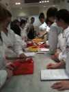 Chef instructor with students in Mediterranean Diet- A guide to healthy living class