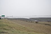 A county road disappears under receding floodwaters near Craig, Missouri. Many roads in the area were impassible in March due to flooding