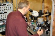 David Schulz examines neurons under a microscope