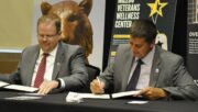 Chancellor Alexander Cartwright signs a Memorandum of Understanding with the Truman VA to make accessing health resources for veterans easier.